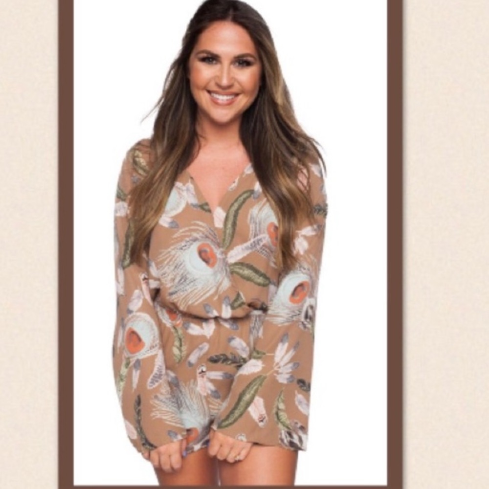 Buddy love romper with peacock feather patter.